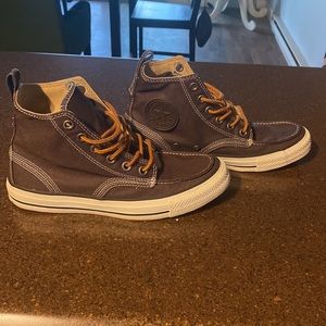 Never worn brown Converse high-tops. Size 6 mens, size 8 women’s.
